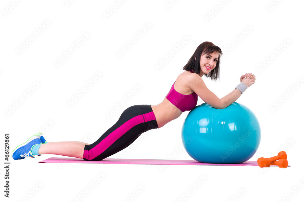 Young smiling woman makes exercise with fitball Young smiling woman makes exercise with fitball