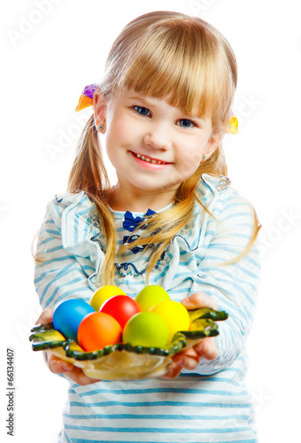 sweet little girl with plate of Easter eggs