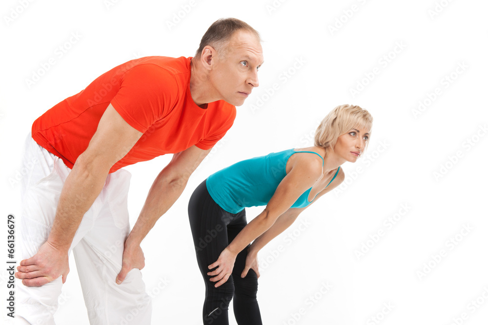 man and woman stretching on white background. man and woman stretching on white background.