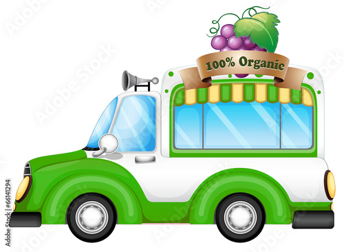 A green vehicle selling organic fruits