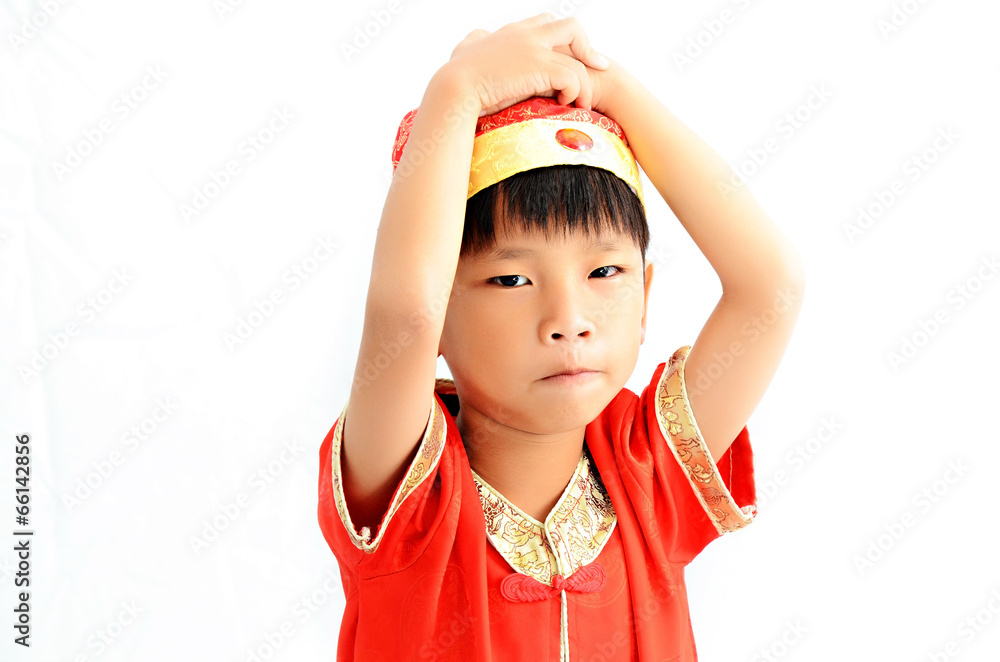 China boy in traditional Chinese red Tang suit greeting China boy in traditional Chinese red Tang suit greeting