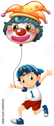 A boy holding a clown balloon