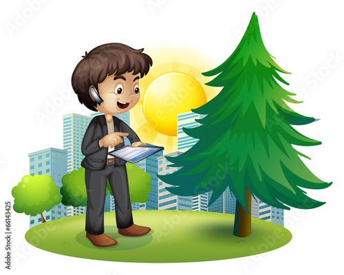 A man using his gadget outside the building