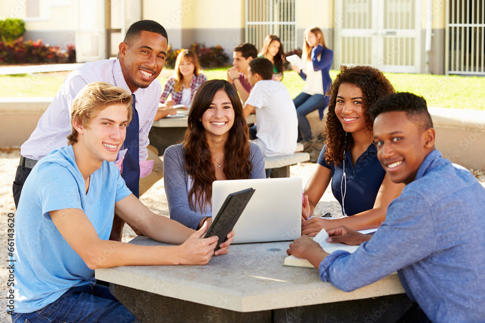 High School Students Working On Campus With Teacher High School Students Working On Campus With Teacher