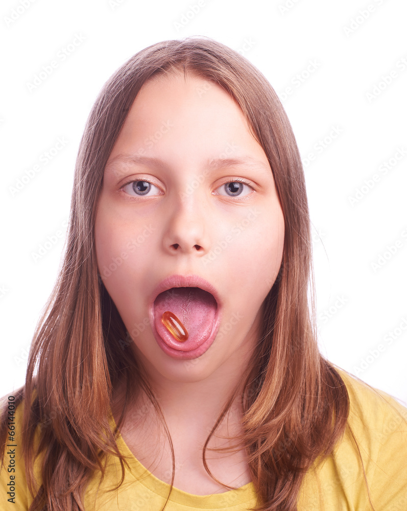 teenager girl with a pill isolated on white teenager girl with a pill isolated on white