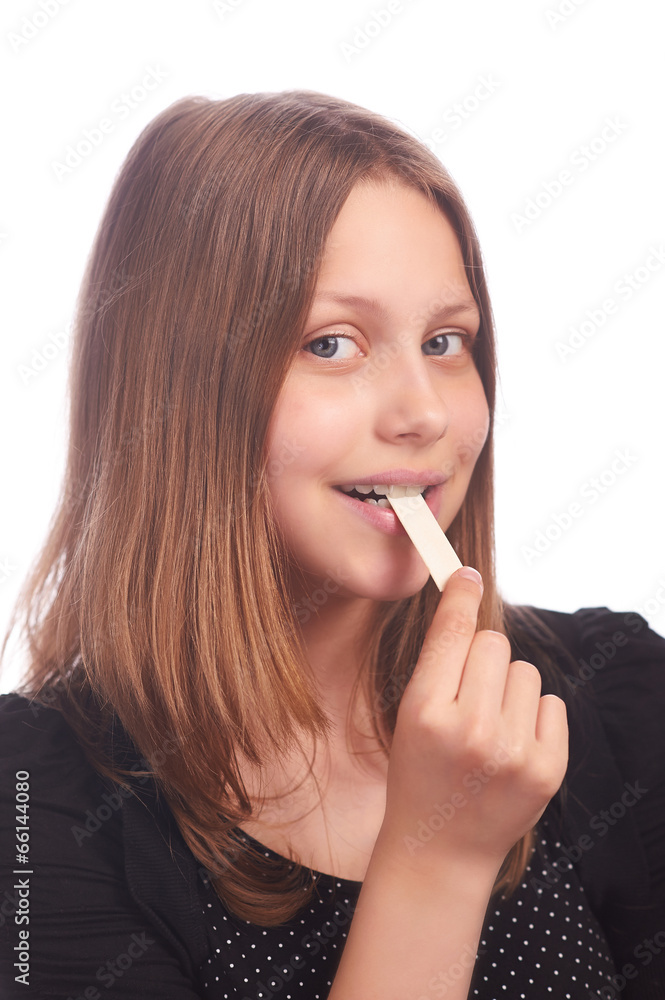 teen girl eating bubblegum on white background teen girl eating bubblegum on white background