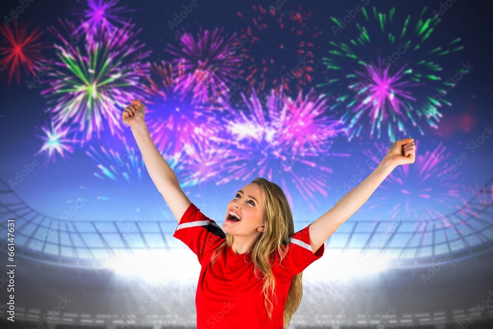 Composite image of cheering football fan in red Composite image of cheering football fan in red