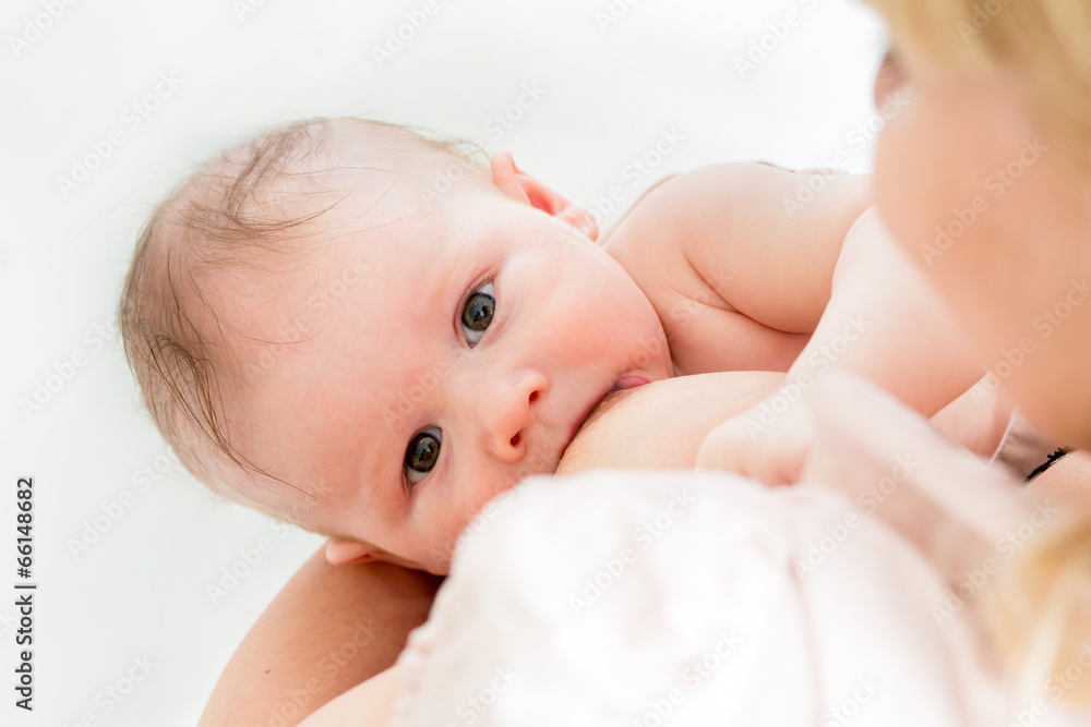 happy mother breast feeding her cute baby happy mother breast feeding her cute baby