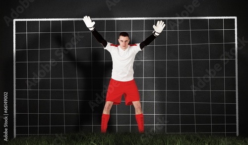 Composite image of goalkeeper in red and white ready to catch