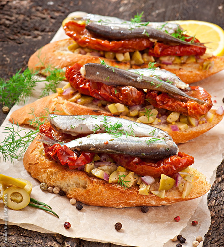 Crostini with anchovies, olives and sun-dried tomatoes