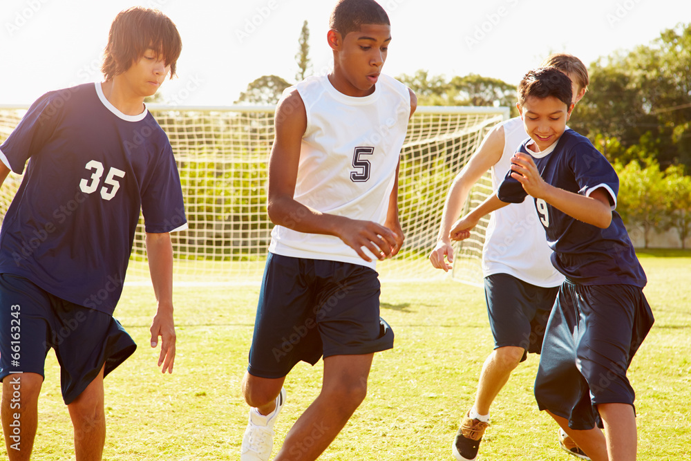 members-of-male-high-school-soccer-playing-match-foto-de-stock-adobe