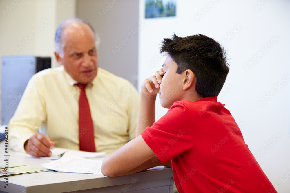 Fototapeta premium Male Student Talking To High School Counselor