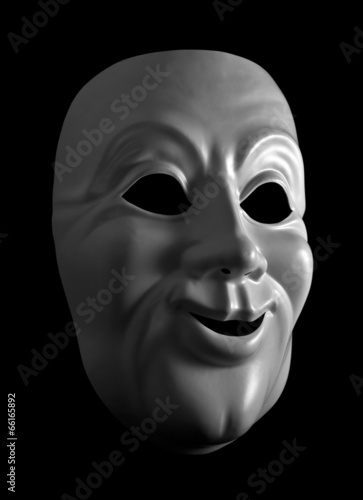 White mask against a dark background.