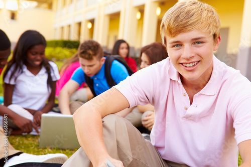 High School Students Studying Outdoors On Campus