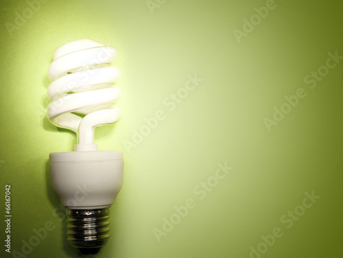 Light bulb on green. Copy space