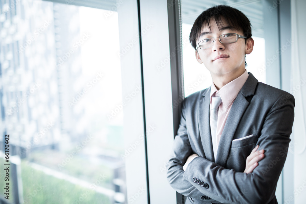 Portrait of a businessman looking at the window Portrait of a businessman looking at the window