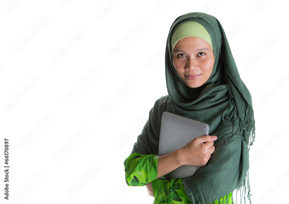 Muslim woman in hijab with a laptop Stock Photo | Adobe Stock