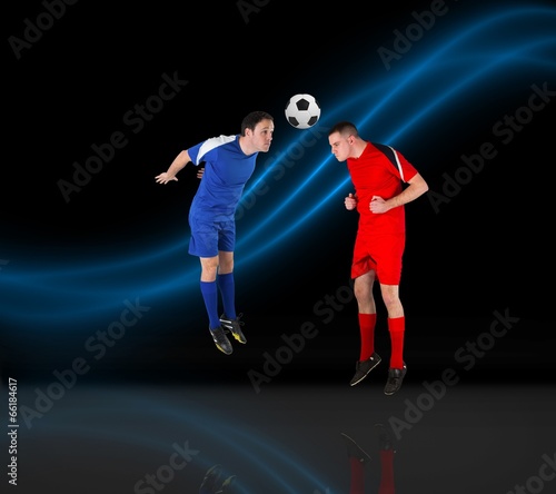 Composite image of football players tackling for the ball