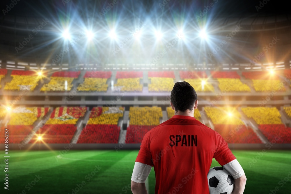 Composite image of spain football player holding ball - obrazy, fototapety, plakaty 