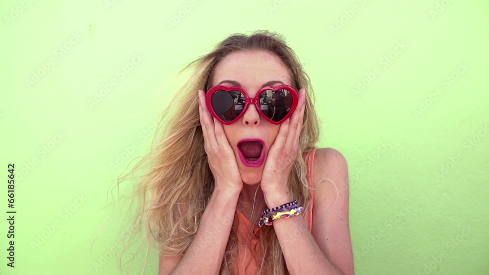 Young woman sticking her tongue out slow motion Young woman sticking her tongue out slow motion