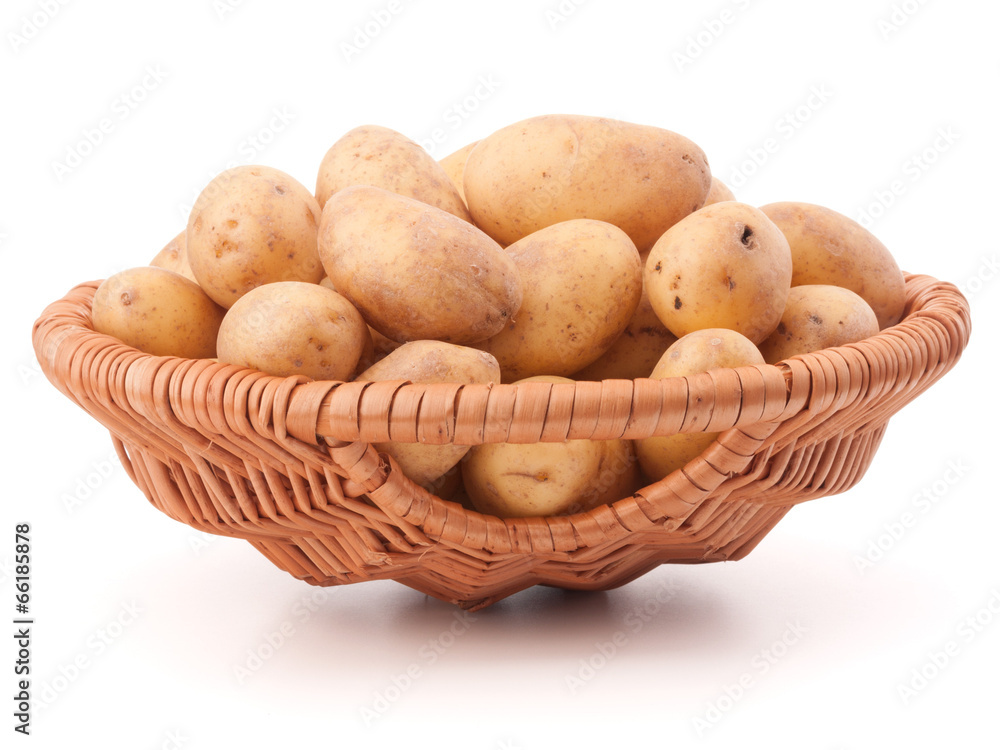 Potato tuber in wicker basket isolated on white background Potato tuber in wicker basket isolated on white background