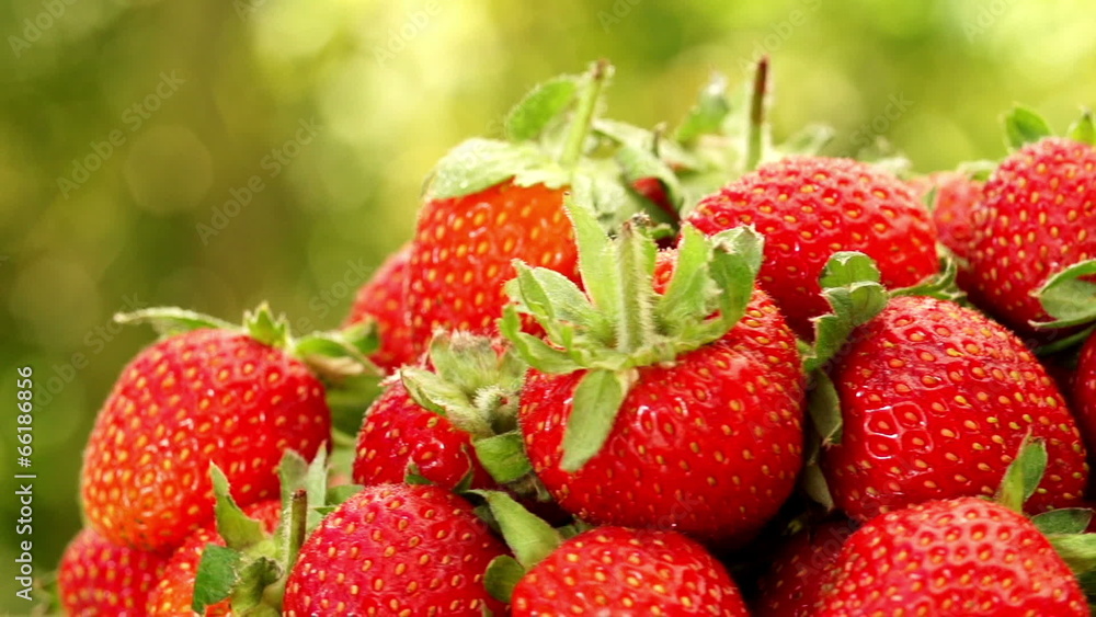 Close-up of strawberries turning in slow motion Close-up of strawberries turning in slow motion