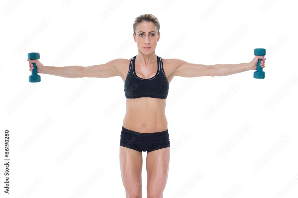Female bodybuilder holding two dumbbells with arms out Female bodybuilder holding two dumbbells with arms out