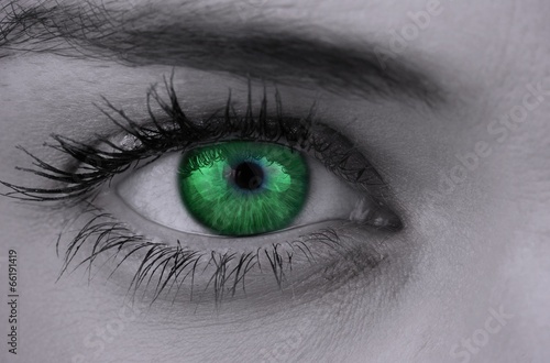 Bright green eye on female face