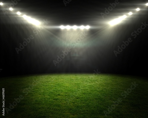 Football pitch under bright spotlights photo