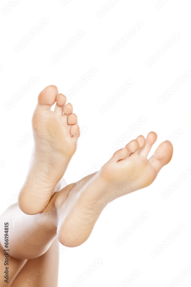 female bare feet on white background