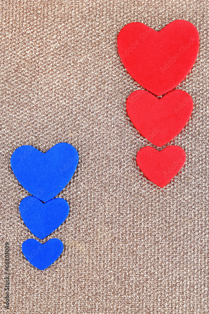 Obraz premium Hearts made of felt on golden background