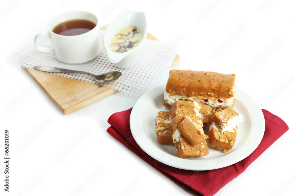 Sherbet with nuts on plate isolated on white Sherbet with nuts on plate isolated on white