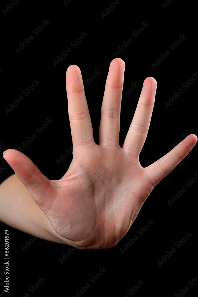 Fototapeta premium Human hand on black background