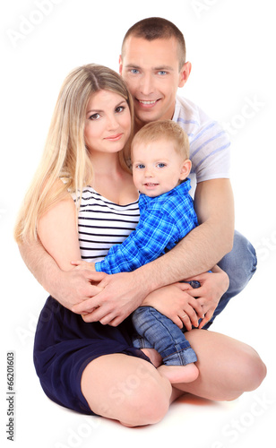 Happy young couple with small baby isolated on white