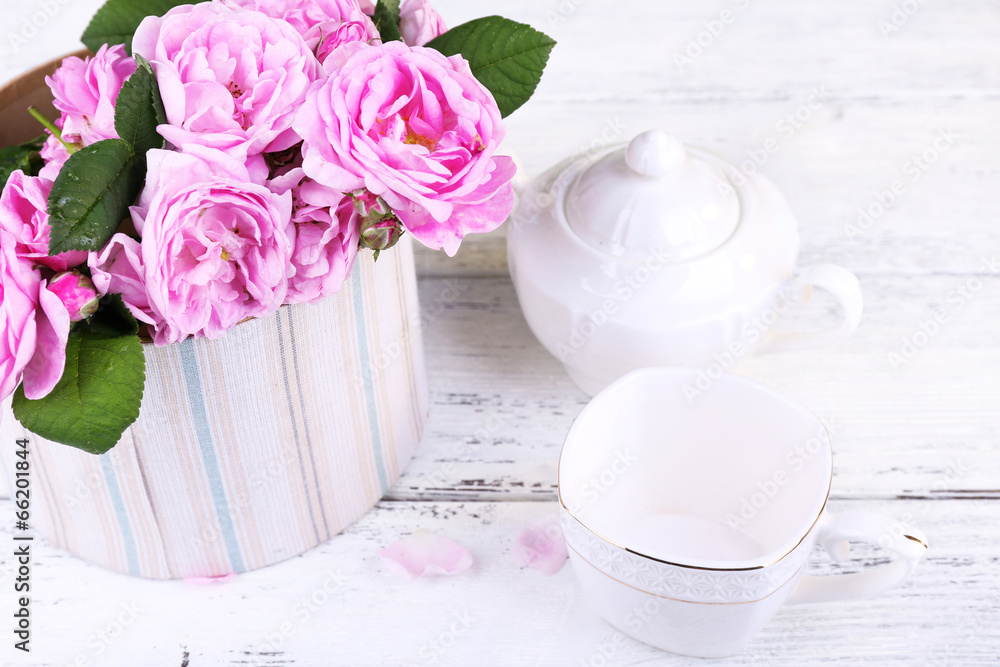 Breakfast tea with teapot of fresh pink garden roses Breakfast tea with teapot of fresh pink garden roses