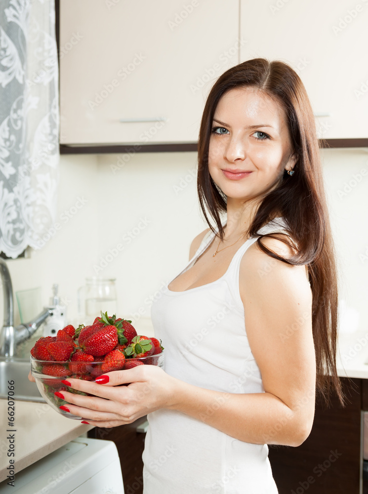 brunette with plate of strawberries brunette with plate of strawberries