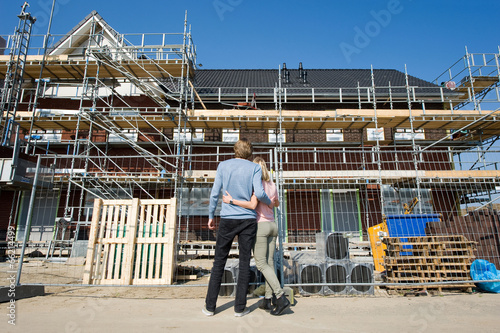 Young couple on construction site