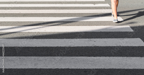Person walking on a zebra crossing