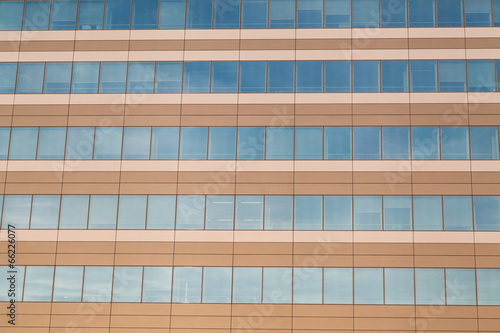 Horizontal row of office building windows in frames