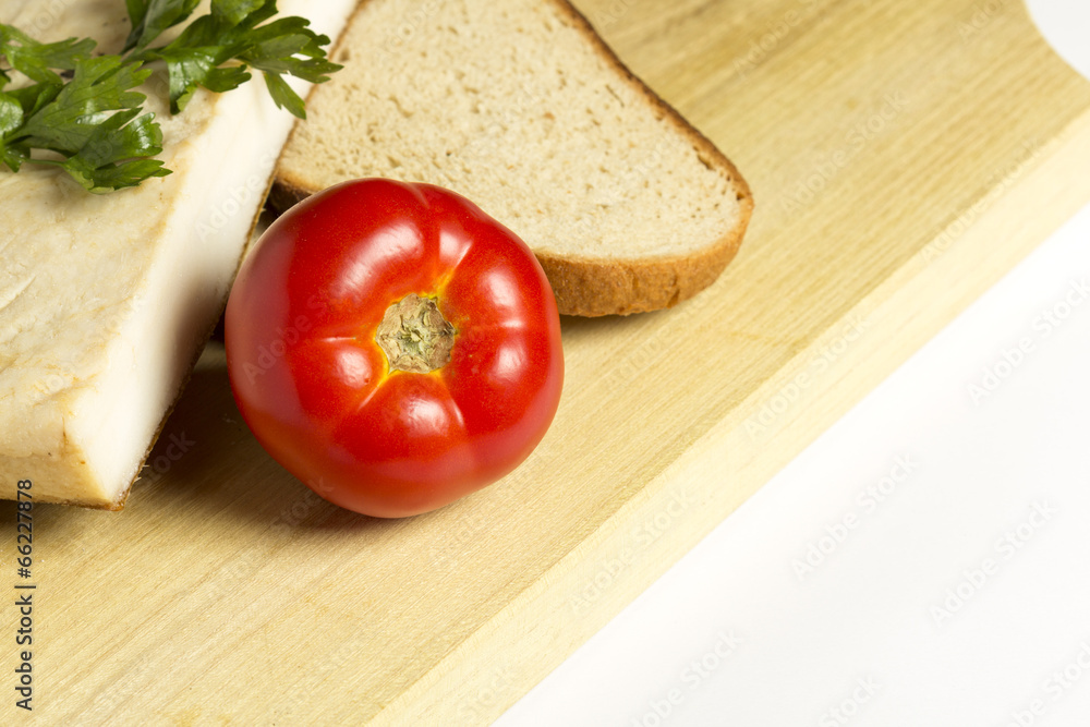 Bacon with tomatoes and bread isolated on white Bacon with tomatoes and bread isolated on white