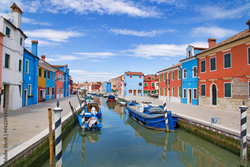Venice, Burano island, small brightly-painted houses and channel