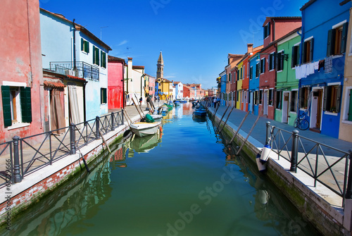Venice, Burano island, small brightly-painted houses and channel