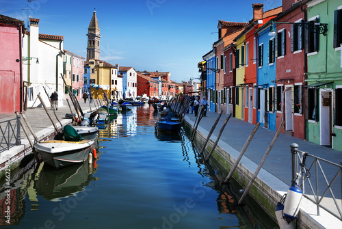 Venice, Burano island, small brightly-painted houses and channel © EMrpize
