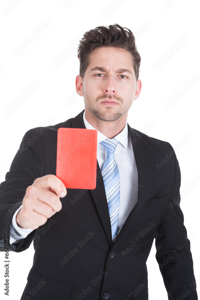 Handsome Young Businessman Showing Red Card Handsome Young Businessman Showing Red Card