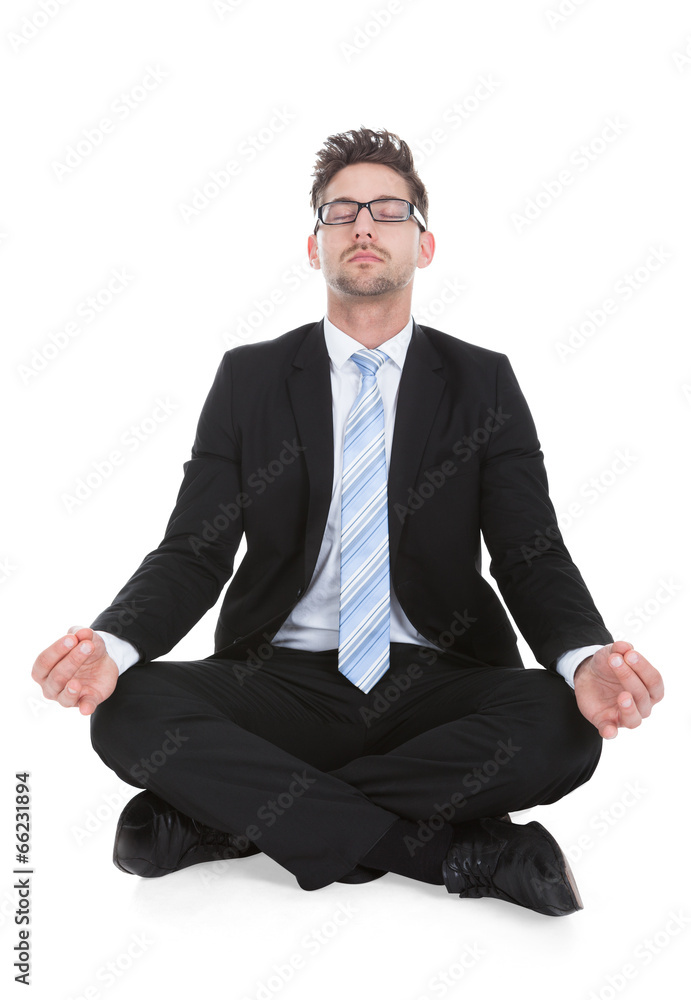 Businessman Meditating Over White Background Businessman Meditating Over White Background