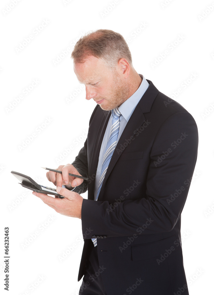 Businessman Using Calculator Businessman Using Calculator