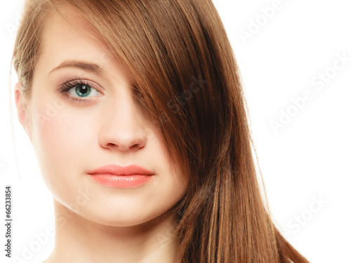 Hairstyle. Portrait of girl with long bang covering eye