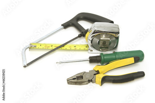 Carpenter tools  with  saw pliers  screwdriver and measuring tap photo