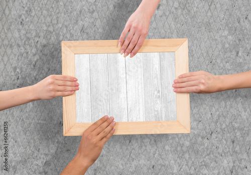 Hands holding frame