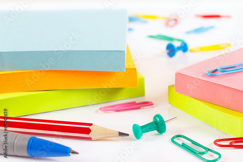 Stationery supplies on white desktop close up